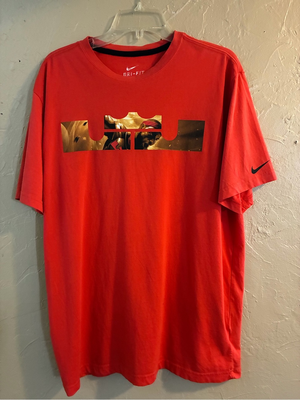 Nike Men’s Red Short-Sleeve Dri-FIT Tee with Gold Graphic LeBron James King logo